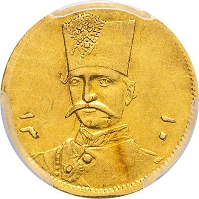 a close up of a gold coin with a man wearing a hat