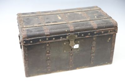 an old trunk with a lock on it on a white surface