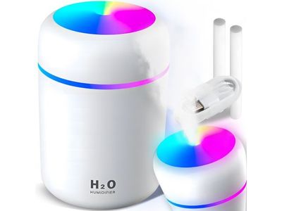 une image représentant un humidificateur blanc orné d'une lumière colorée