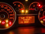 a close up of a car ' s dashboard with various gauges and numbers