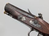 an old gun that is on display in a museum