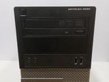 a black desktop computer sitting on top of a white table
