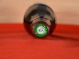 a bottle of wine that is sitting on a table