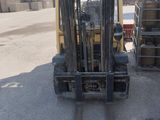 a picture of a forklift truck parked in a lot