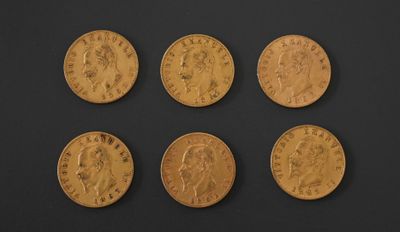 six gold sovereigns, one of which has a head of a man and four of which are of different