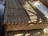 several pieces of rope are stacked on top of each other on a bench