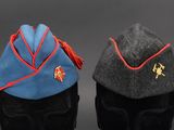 two hats with red and blue trims are sitting next to each other