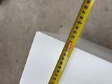 a measuring tape on top of a piece of paper