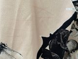 a close up of a black and white dress with dragonflies on it