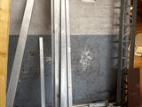 several pieces of metal are stacked on top of each other in a warehouse