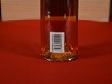 a bottle of wine sitting on a table with a label on it