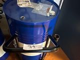 a blue barrel sitting on top of a wooden table