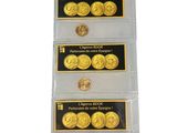 a set of three gold coins in a clear plastic holder