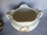 a large white bowl with a handle and a handle on it