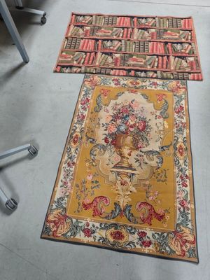 two rugs on the floor in a room with a chair and a desk