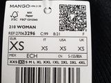 a label of a woman ' s black sweater with a barcode on it