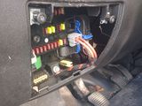 the interior of a car with a dash board and wires in it