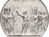 une pièce d'argent sur laquelle figure l'image d'un groupe de personnes