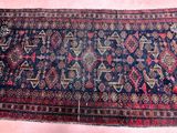 a close up of a rug on a pink surface with a pink background