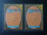 two decks of magic the gathering deck cards on a table