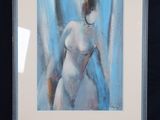 an image of a painting of a nude woman on a easel