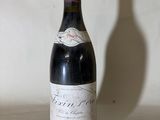 a bottle of wine that is sitting on a table