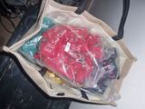 a bag full of red and green items on a table