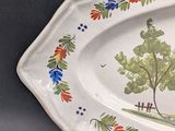 a platter with a picture of a tree on it