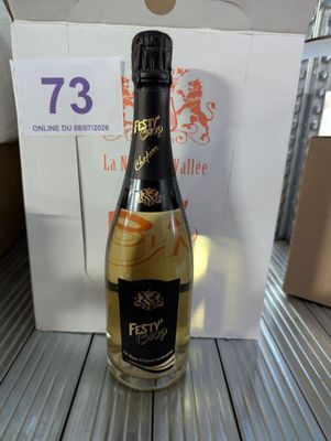 a bottle of wine sitting on a table next to a box
