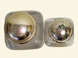 pair of silver plated salt and pepper shakers on a white background