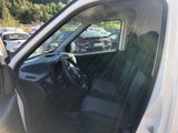 the interior of a car with the door open and the driver ' s seat down