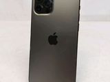 an apple iphone is sitting on top of a stand on a table