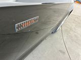 a close up of a car ' s emblem on the side of the car