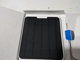 a small air conditioner in the corner of a room