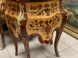 two pieces of furniture that are sitting on a tile floor
