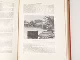an open book with a picture of a house on it