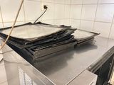 a stack of pans sitting on top of a stove