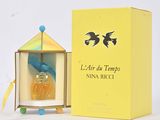 perfume bottle in a yellow box with a bird on top of it