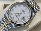 a rolex watch that is on display in a box