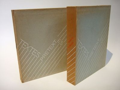 two books that are sitting side by side on a table