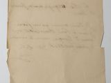 a piece of paper with writing on it sitting on top of a table