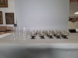 a table with a bunch of wine glasses on it