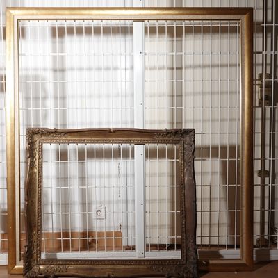 two frames sitting next to each other on the floor