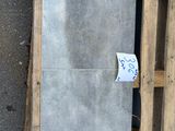 a picture of a building being built with pallets on the ground