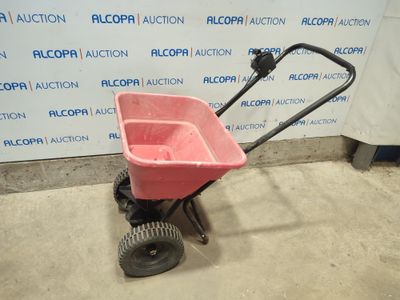 an image of a pink wagon with wheels in a garage