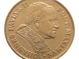 l'image d'une pièce d'or sur laquelle figure le portrait d'un homme
