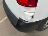 a white van with a red light on the back of it