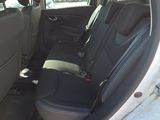 the back seats of a car with a seat belt in the back of it