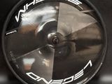 a close up of a wheel on a black surface