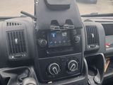 a dashboard of a truck with a bunch of items in it